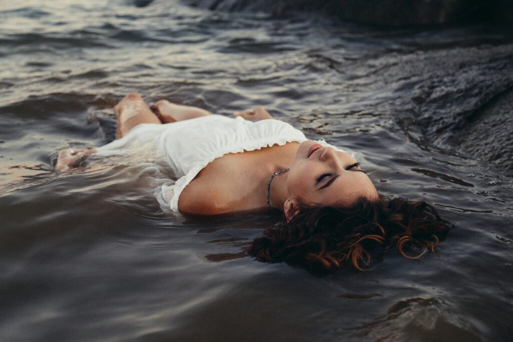 A woman floating at the beach